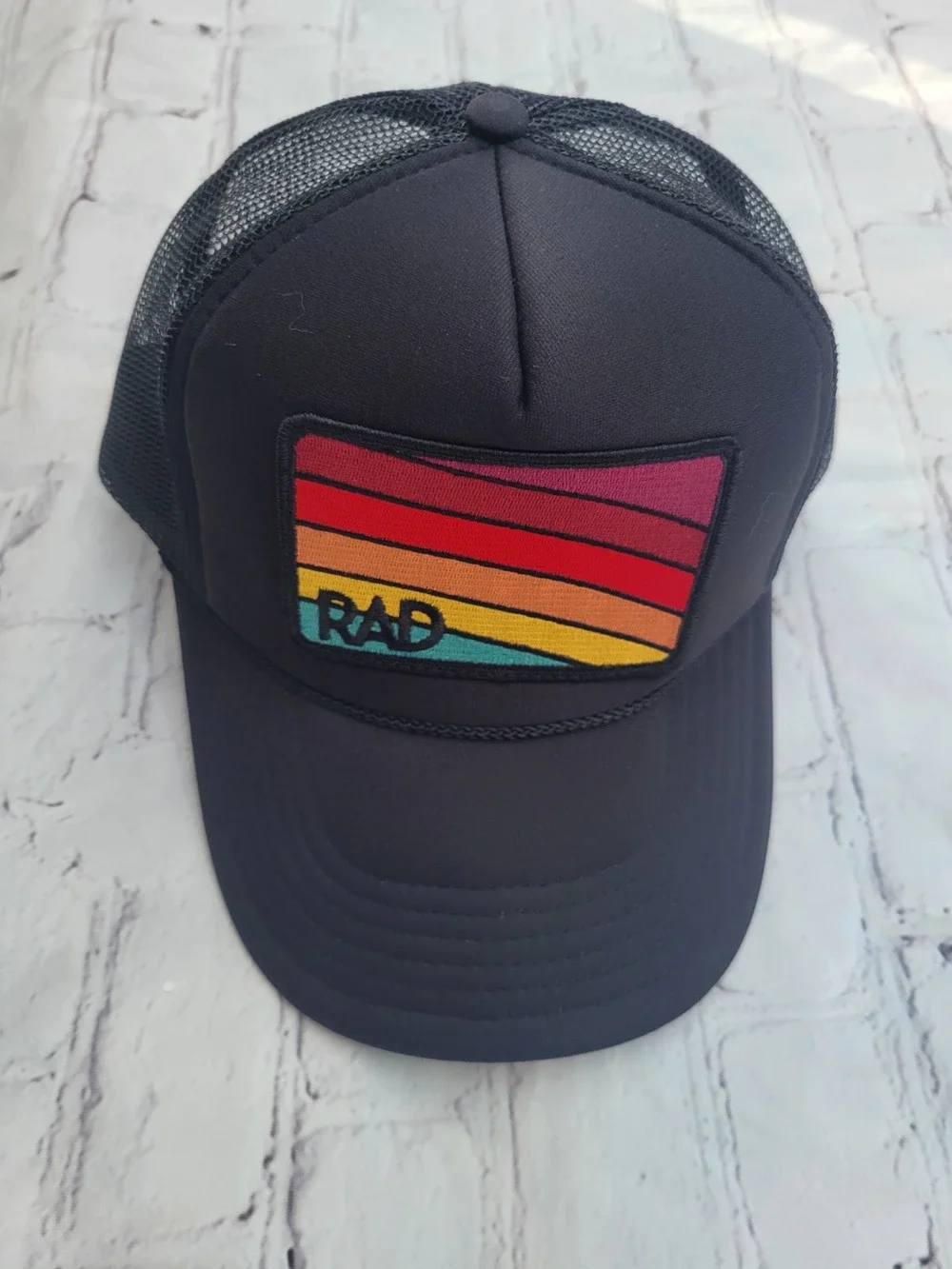 RAD - Black with colorful patch trucker hat